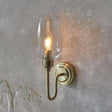 Acheron Wall Light Antique Brass w/ Clear Glass - Comet Lighting