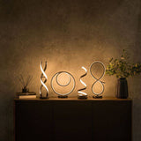 Infinity LED Double Twist Touch Table Lamp In Matte Black - Comet Lighting